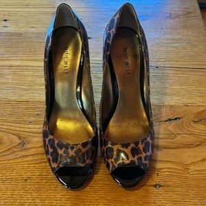 Brand new Nine West leopard print peep toe high heels. Heels are 3.75”.